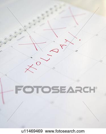 Close-up of holiday written on calendar View Large Photo Image Stock Photo - Close-up of holiday written on calendar. Fotosearch