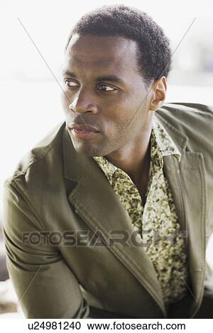 "Close-up of pensive man, outdoors" View Large Photo Image Stock Image - "Close-up of pensive man, outdoors". Fotosearch