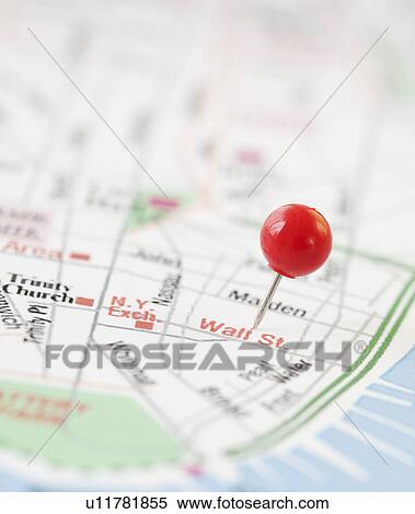 Stock Photography - Close-up of pin on wall street map. Fotosearch
