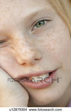 Picture - "Close-up of smiling girl (10-12), portrait". Fotosearch