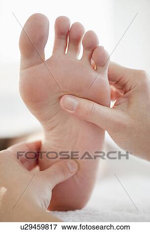 Close-up of woman having foot massage View Large Photo Image Stock Photo - Close-up of woman having foot massage. Fotosearch