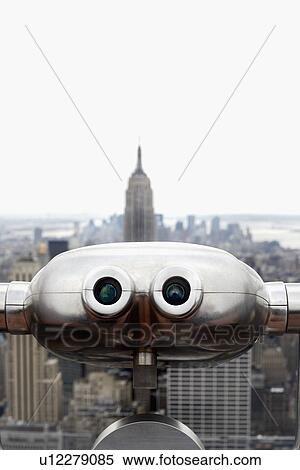 Stock Photography - "Coin operated binoculars pointing at Empire State Building, New York City, New York, USA". Fotosearch