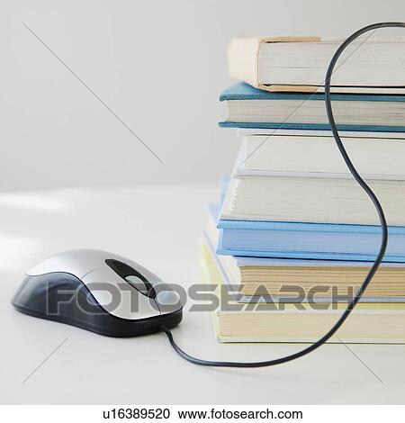 "Computer mouse near pile of books, studio shot" View Large Photo Image Stock Image - "Computer mouse near pile of books, studio shot". Fotosearch