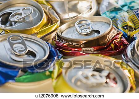 Stock Photograph - "Crushed cans for recycling, studio shot". Fotosearch