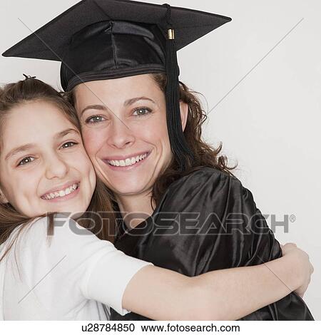 "Daughter (10-12 years) embracing mother after her graduation, smiling, portrait" View Large Photo Image Stock Image - "Daughter (10-12 years) embracing mother after her graduation, smiling, portrait". Fotosearch