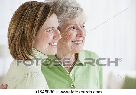 Daughter hugging mother side by side View Large Photo Image Stock Image - Daughter hugging mother side by side. Fotosearch
