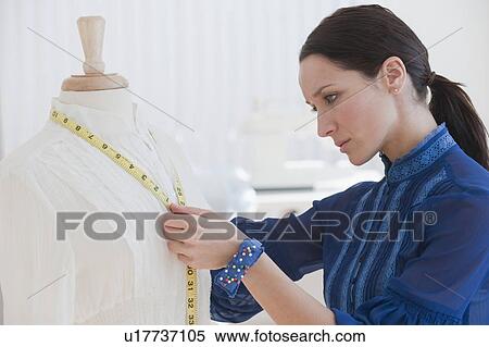Female tailor at work View Large Photo Image Stock Photography - Female tailor at work. Fotosearch