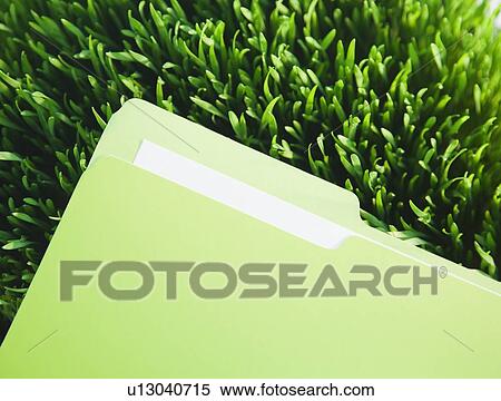 Stock Photography - File on grass. Fotosearch