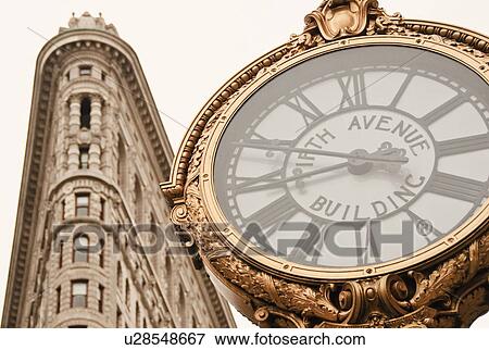 Stock Photo - "Flatiron Building and clock, Manhattan, New York City, New York, USA". Fotosearch