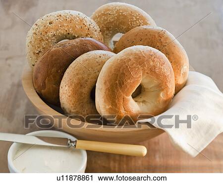 Stock Image - Freshly baked bagels. Fotosearch