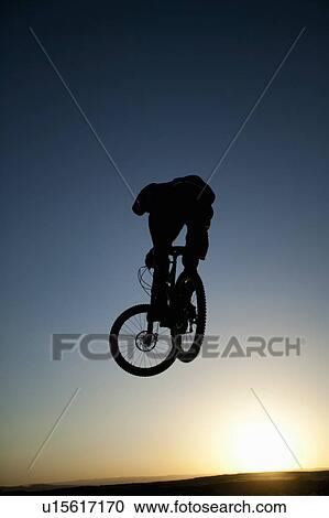 Stock Image - "Fruita, Person performing stunt on bicycle, Fruita, Colorado, USA". Fotosearch