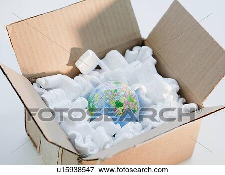 Stock Photo - Globe in cardboard box with packing peanuts. Fotosearch