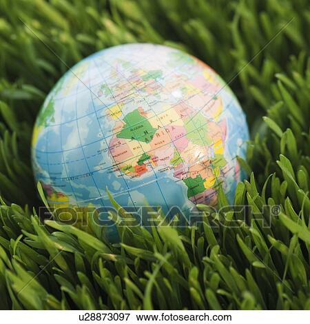 Globe on grass View Large Photo Image Stock Photo - Globe on grass. Fotosearch