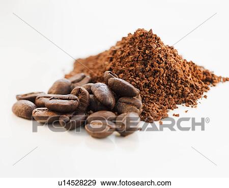 Stock Photo - Heap of coffee beans and ground coffee. Fotosearch