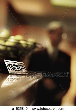 "Information sign in hotel reception and man in background, Dallas, Texas, USA" View Large Photo Image Picture - "Information sign in hotel reception and man in background, Dallas, Texas, USA". Fotosearch