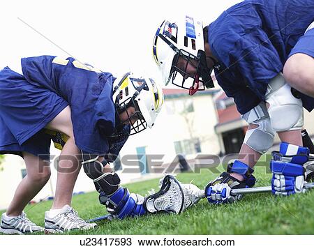 Lacrosse players in field View Large Photo Image Stock Image - Lacrosse players in field. Fotosearch