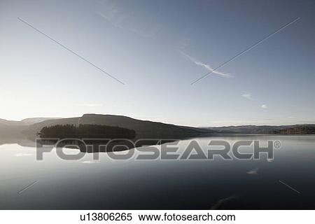 Stock Photography - "Land reflected in calm water, Norway, ". Fotosearch
