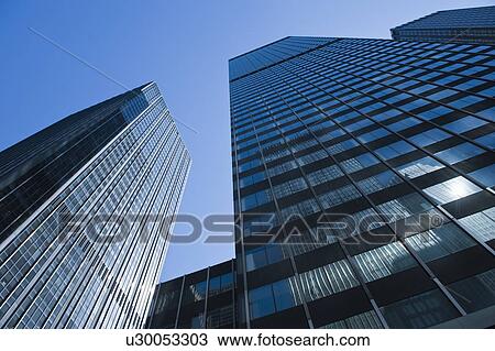 "Low angle view of skyscrapers, New York City, New York, USA" View Large Photo Image Stock Image - "Low angle view of skyscrapers, New York City, New York, USA". Fotosearch