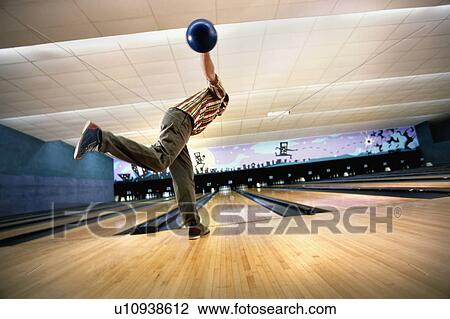 "Man bowling, rear view" View Large Photo Image Stock Image - "Man bowling, rear view". Fotosearch