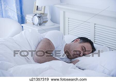 Stock Photo - Mature man sleeping. Fotosearch