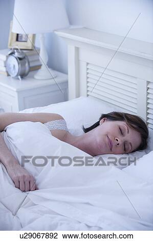 Mature woman sleeping View Large Photo Image Stock Image - Mature woman sleeping. Fotosearch