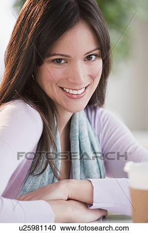 Stock Image - "Mid-adult woman, portrait". Fotosearch
