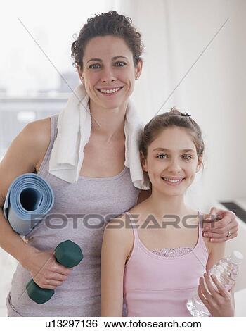 "Mother and daughter (10-12 years) preparing to do yoga, portrait" View Large Photo Image Stock Photograph - "Mother and daughter (10-12 years) preparing to do yoga, portrait". Fotosearch