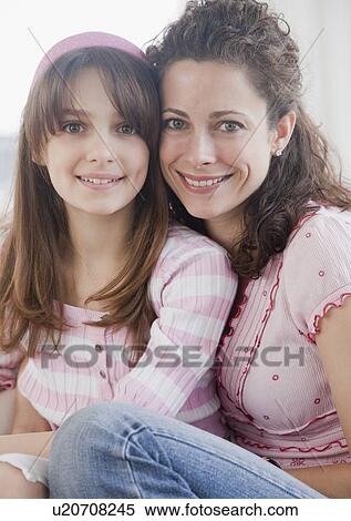 "Mother and daughter (10-12 years) embracing, smiling, portrait" View Large Photo Image Stock Photography - "Mother and daughter (10-12 years) embracing, smiling, portrait". Fotosearch