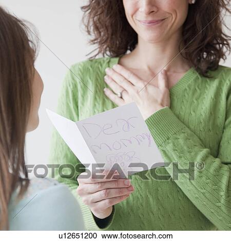 Mother receiving greeting card on mother's day from daughter (10-12 years) View Large Photo Image Stock Image - Mother receiving greeting card on mother's day from daughter (10-12 years). Fotosearch