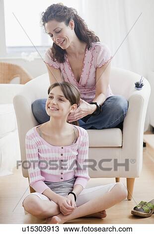 Mother styling daughters (10-12 years) hair View Large Photo Image Stock Image - Mother styling daughters (10-12 years) hair. Fotosearch