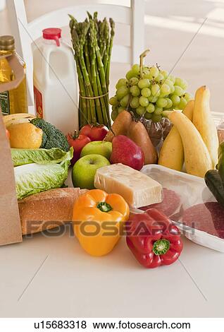 Paper bag filled with groceries View Large Photo Image Stock Photo - Paper bag filled with groceries. Fotosearch