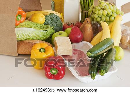 Stock Photography - Paper bag filled with groceries. Fotosearch