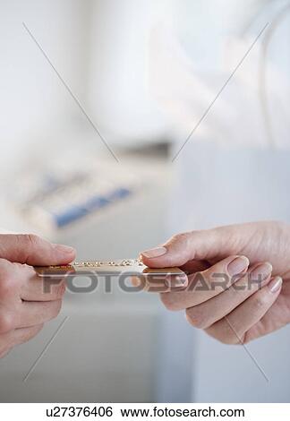 "People holding credit card, close-up" View Large Photo Image Stock Photograph - "People holding credit card, close-up". Fotosearch