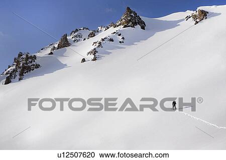 "Person walking in snow up mountain, Aspen, Colorado, USA " View Large Photo Image Stock Image - "Person walking in snow up mountain, Aspen, Colorado, USA ". Fotosearch