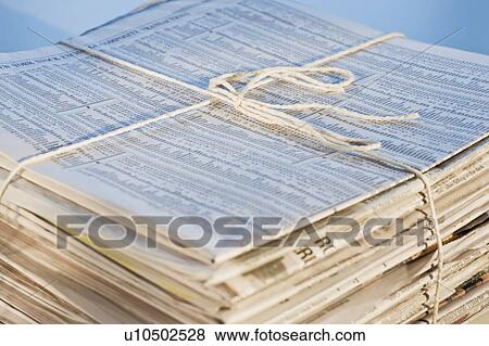 Stock Photo - "Pile of newspapers for recycling, studio shot". Fotosearch