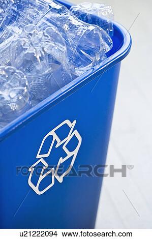 Picture - "Plastic bottles in recycling bin, studio shot". Fotosearch