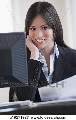 Stock Photo - Portrait of Businesswoman at work. Fotosearch