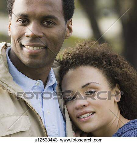 "Portrait of couple embracing, outdoors" View Large Photo Image Stock Image - "Portrait of couple embracing, outdoors". Fotosearch