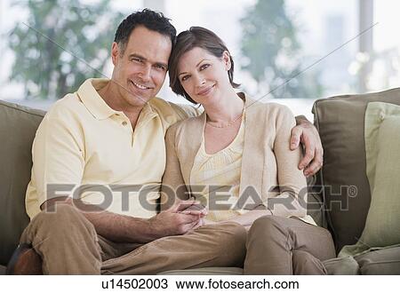 Portrait of couple on sofa View Large Photo Image Stock Image - Portrait of couple on sofa. Fotosearch