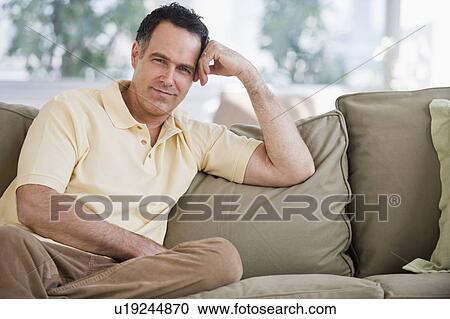 Portrait of man on sofa View Large Photo Image Stock Image - Portrait of man on sofa. Fotosearch
