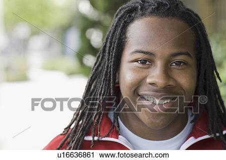 "Portrait of teenage boy (16-17) with dreadlocks, smiling" View Large Photo Image Stock Image - "Portrait of teenage boy (16-17) with dreadlocks, smiling". Fotosearch