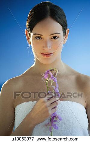 Portrait of woman holding exotic flowers View Large Photo Image Stock Photo - Portrait of woman holding exotic flowers. Fotosearch