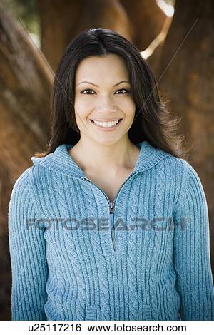 Portrait of woman in park View Large Photo Image Stock Photograph - Portrait of woman in park. Fotosearch
