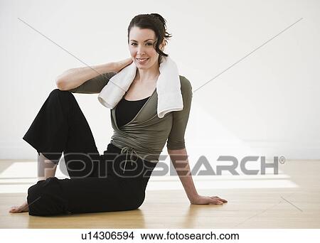 Picture - "Portrait of woman relaxing after exercise, studio shot". Fotosearch