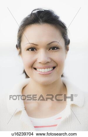 "Portrait of woman smiling, outdoors" View Large Photo Image Picture - "Portrait of woman smiling, outdoors". Fotosearch