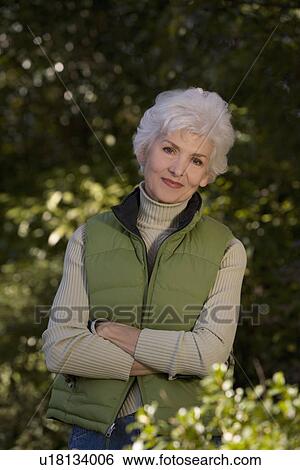 Senior woman in orchard; portrait View Large Photo Image Stock Photograph - Senior woman in orchard; portrait. Fotosearch