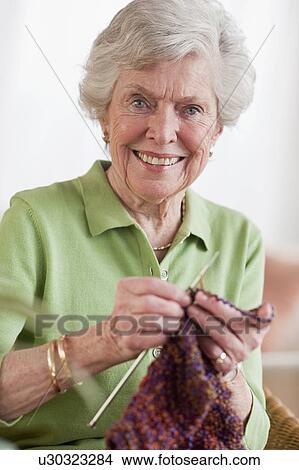 Picture - Senior woman knitting. Fotosearch