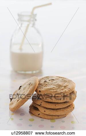 Stack of cookies with milk on table View Large Photo Image Stock Photo - Stack of cookies with milk on table. Fotosearch