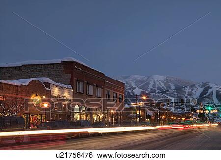 Stock Photograph - "Steamboat Springs, Town at night with mountains in background, Steamboat Springs, Colorado, Use". Fotosearch