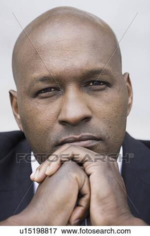 Stock Photo - Studio portrait of businessman. Fotosearch